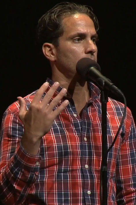 Mike Scotti telling a story on stage